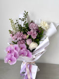 Purple flower bouquet with roses and orchid delivered in Melbourne by Abloom