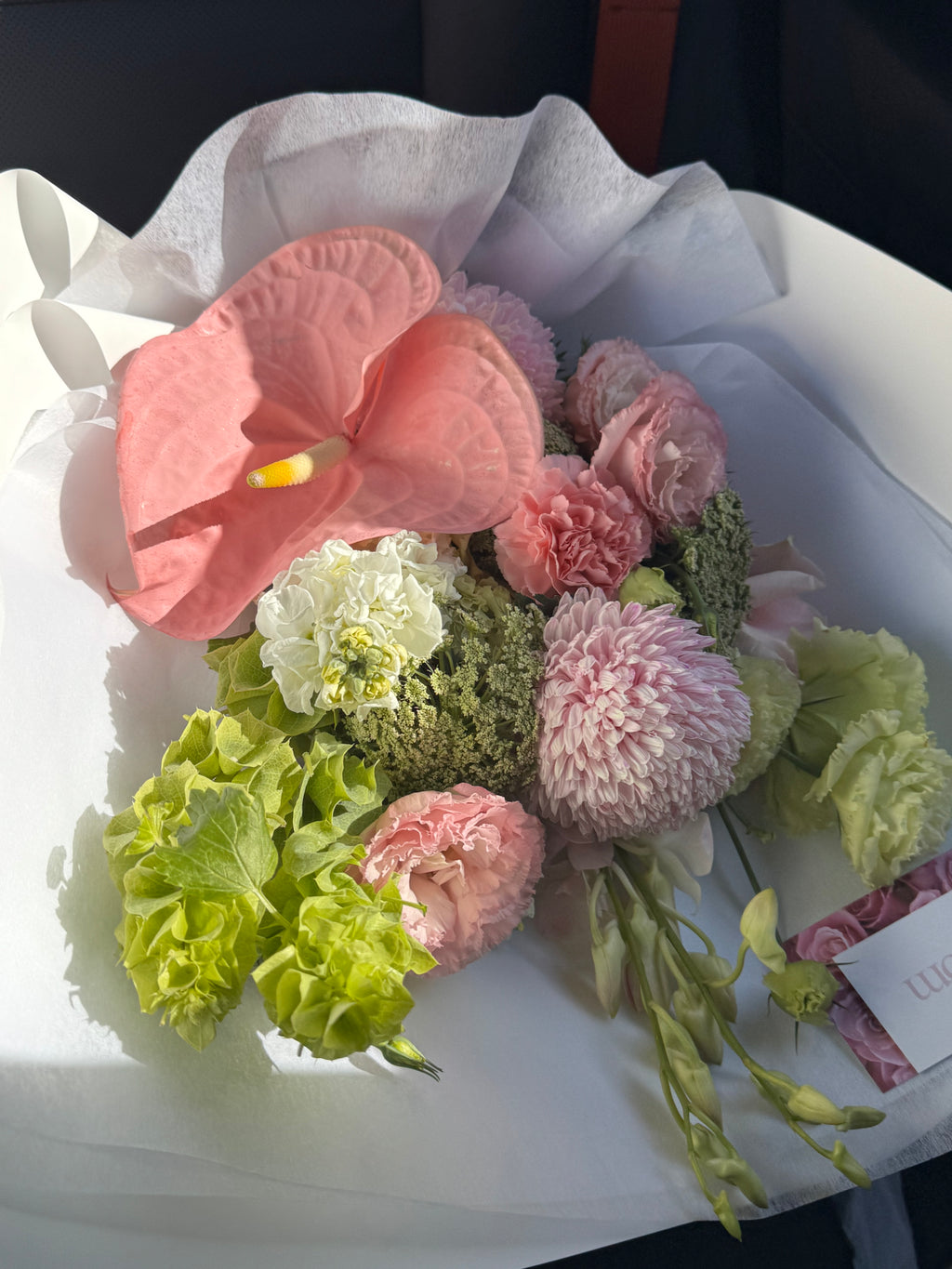 Bouquet of flowers with pink and green colors on a white background