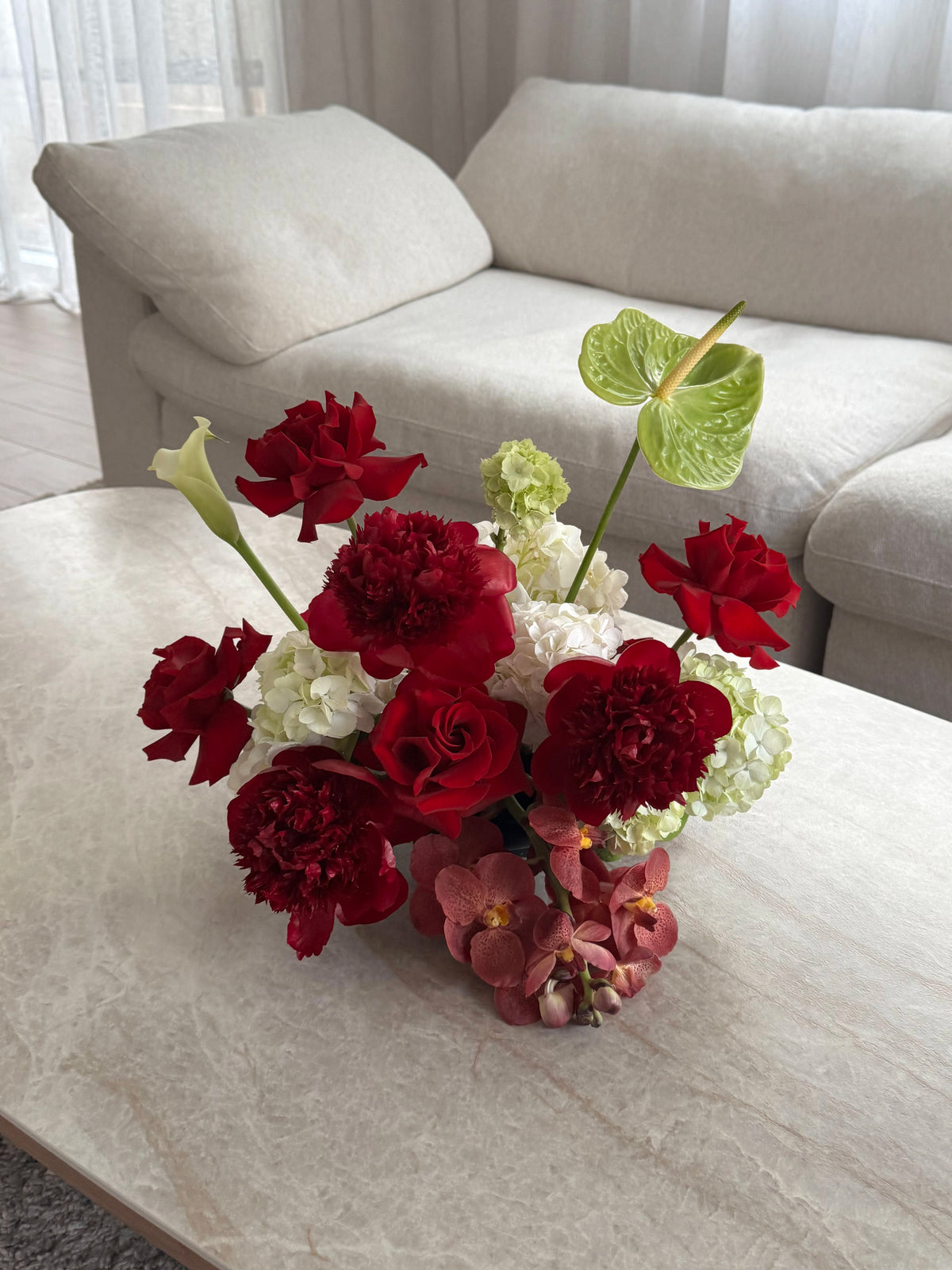 Red roses, white and green floral table centrepiece Melbourne